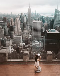 woman looking through tower viewer