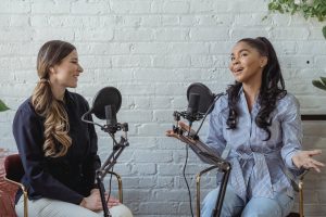 positive black woman talking to radio host