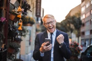 man in black suit jacket received a good news